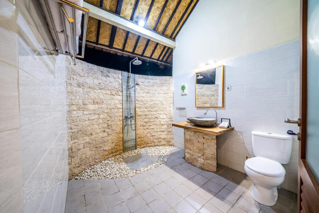 The toilet and shower in the bungalow at Ocean Sun Dive Resort